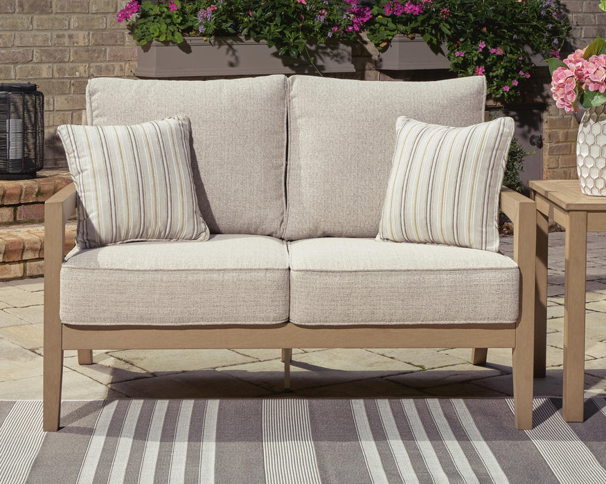 Hallow Creek Outdoor Loveseat with Cushion - Furniture Source (IA) 