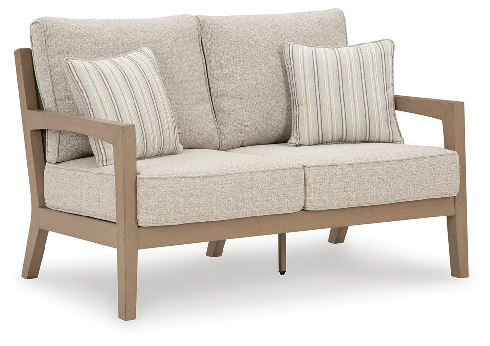 Hallow Creek Outdoor Loveseat with Cushion - Furniture Source (IA) 